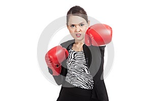 Young Asian business woman with red boxing gloves