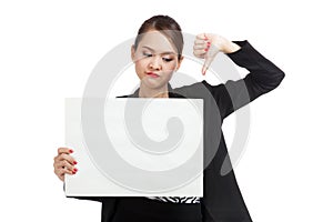 Young Asian business woman show thumbs down with white blank si