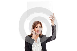 Young Asian business woman surprise with white blank sign