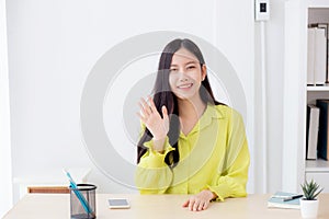 Young asian business woman video call with camera for conference online for interview at home.