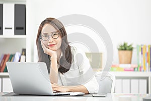 Young asian business woman working with computer .