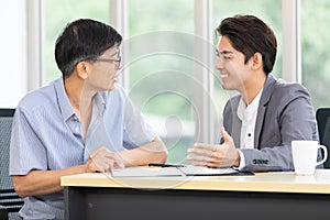 Young asian businessman presenting