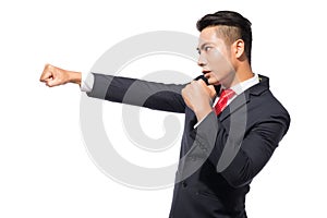 Young asian businessman ready to fight isolated on white