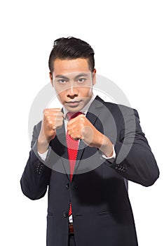 Young asian businessman ready to fight isolated on white