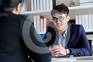 Young asian businessman smiling at business meeting, job interview, in office, business people, office lifestyle concept