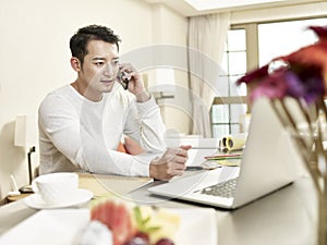 Young asian businessman working from home