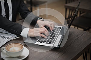 Young Asian businessman working with a laptop