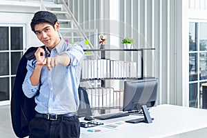 Young Asian Businessperson is standing smart poses and smile at co working space decorated in modern office style for startup