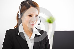 Young asian businesswoman with headset in office