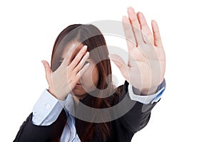 Young Asian businesswoman hide her face say no