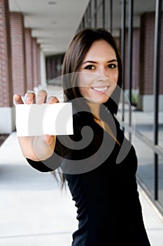 Young asian businesswoman holding a blank card