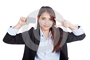 Young Asian businesswoman show victory sign and blank card