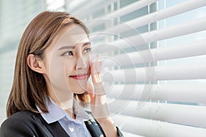 Woman use oil blotting paper photo