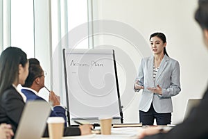 Young asian businesswoman speaking during team meeting