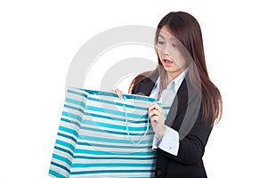 Young Asian businesswoman surprise look inside shopping bag