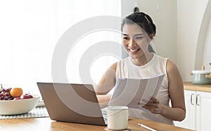 Young Asian businesswoman using computer laptop talking for video call conference meeting. work from home concept