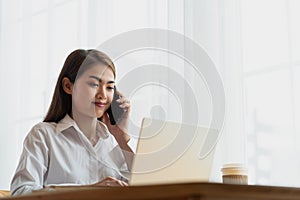 Young Asian businesswoman working at her house with laptop  working at home  business concept