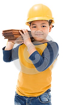 Young asian child construction Worker Holding equipment