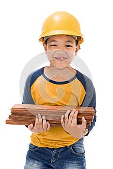 Young asian child construction Worker Holding equipment