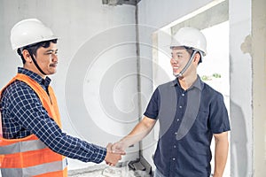 Young asian couple checking house with foreman engineering home inspection building house Walk home inspection with looking and