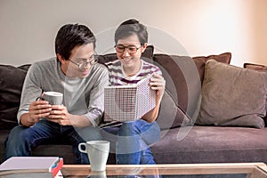 Young asian couple in love and happiness feeling at home on valentines day with flare light effect and copy space, use for couple