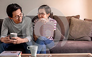 Young asian couple in love and happiness feeling at home on valentines day with flare light effect and copy space, use for couple