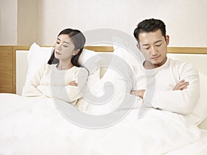 Young asian couple not talking after argument