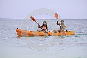 Young asian couple in their kayak