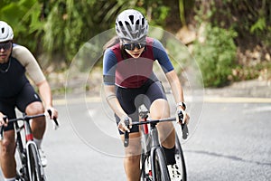 young asian cycling athlete training outdoors