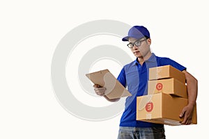 Young Asian delivery man holding a cardboard box Image of delivery boy