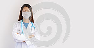 Young asian doctor woman protects herself with mask