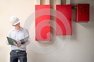 Young Asian Electrical Engineer at construction site