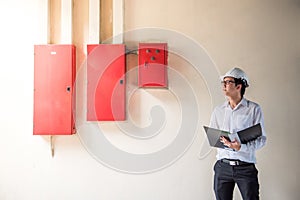 Young Asian Electrical Engineer at construction site