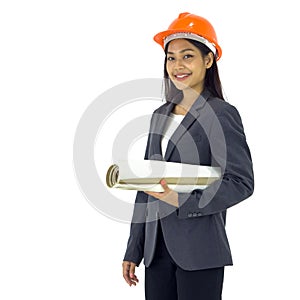 Young asian engineer in gray suit and orange hardhat stand smiling, holding construction drawing of real estate project. Portrait