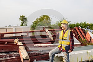 Young Asian engineer inspects architecture, construction project concept, young professional engineer in helmet