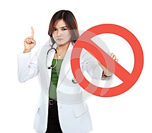 Young asian female doctor holding prohibited sign