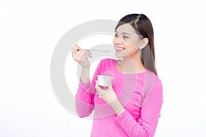 Young asian female enjoying taste of yogurt isolated on white