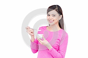 Young asian female enjoying taste of yogurt isolated on white