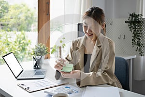 Young female entrepreneur working in modern home office.