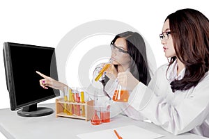 Young Asian female scientists doing research