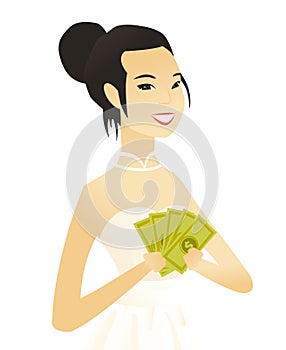 Young asian fiancee holding money.