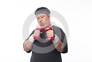 Young Asian funny fat sport man exercise with dumbbell