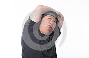 Young Asian funny fat sport man stretching before exercise isolated on white background.