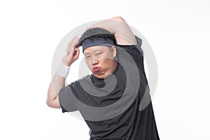 Young Asian funny fat sport man stretching before exercise isolated on white background.