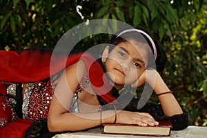 Young Asian girl with book