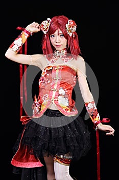 Young asian girl dressed in cosplay costume