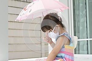 Young Asian girl with face mask protection from  coronavirus illnesses