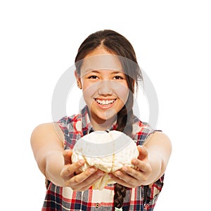 Young Asian girl holds cerebrum model in her hand photo