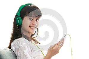 Young Asian girl listening to music with headphone and smarthphone