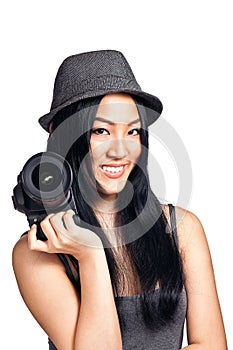 Young asian girl posing with a camera